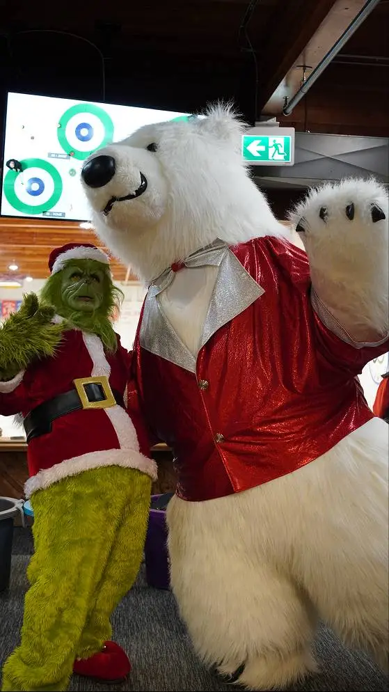 Polar bear mascot with Grinch at holiday event in Vancouver