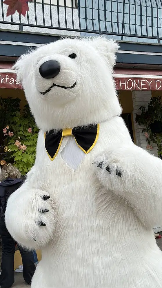 Large polar bear mascot standing