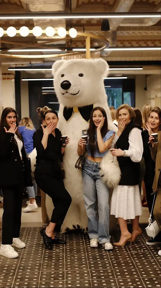 Polar bear mascot posing with guests at a private party in Vancouver