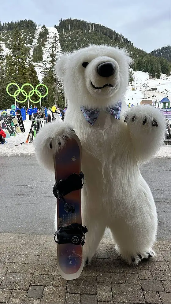 Polar bear mascot with a snowboard at a ski resort in Vancouver, live event entertainment by Grand Show