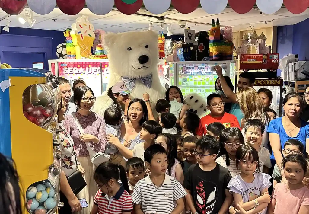 Polar bear mascot entertaining kids at a birthday party in Vancouver