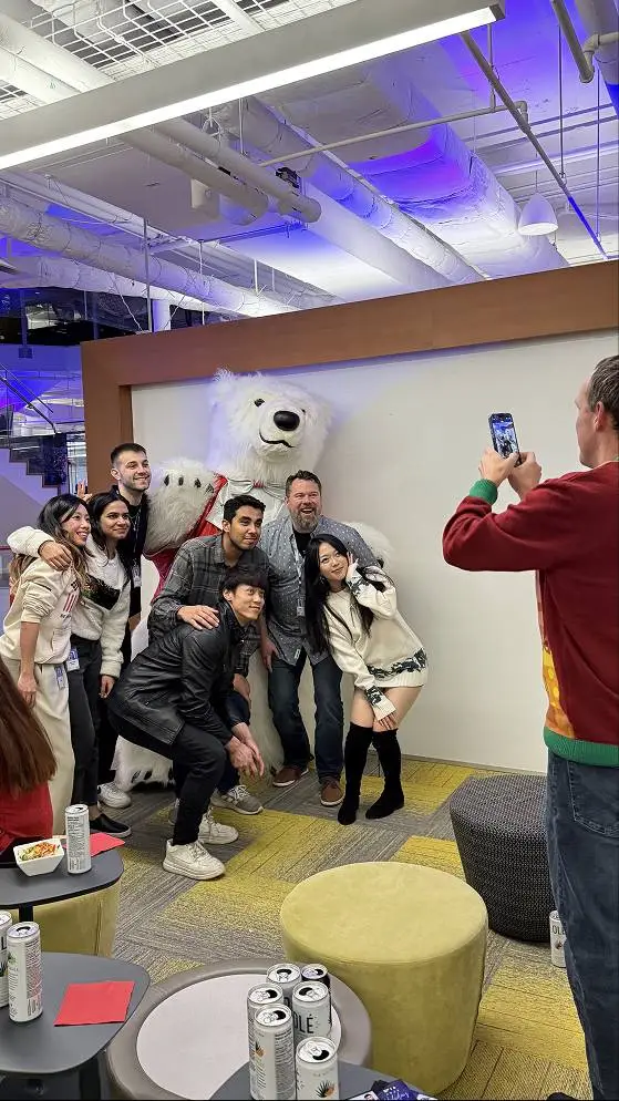 Group photo with a polar bear mascot.