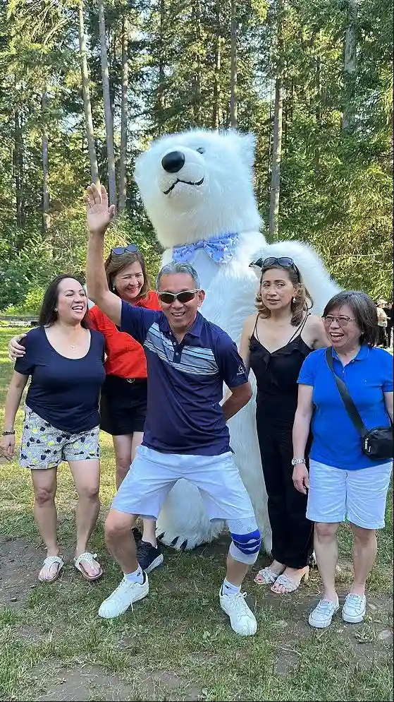 Polar bear party entertainer interacting with guests at an outdoor event in Vancouver by Grand Show Entertainment