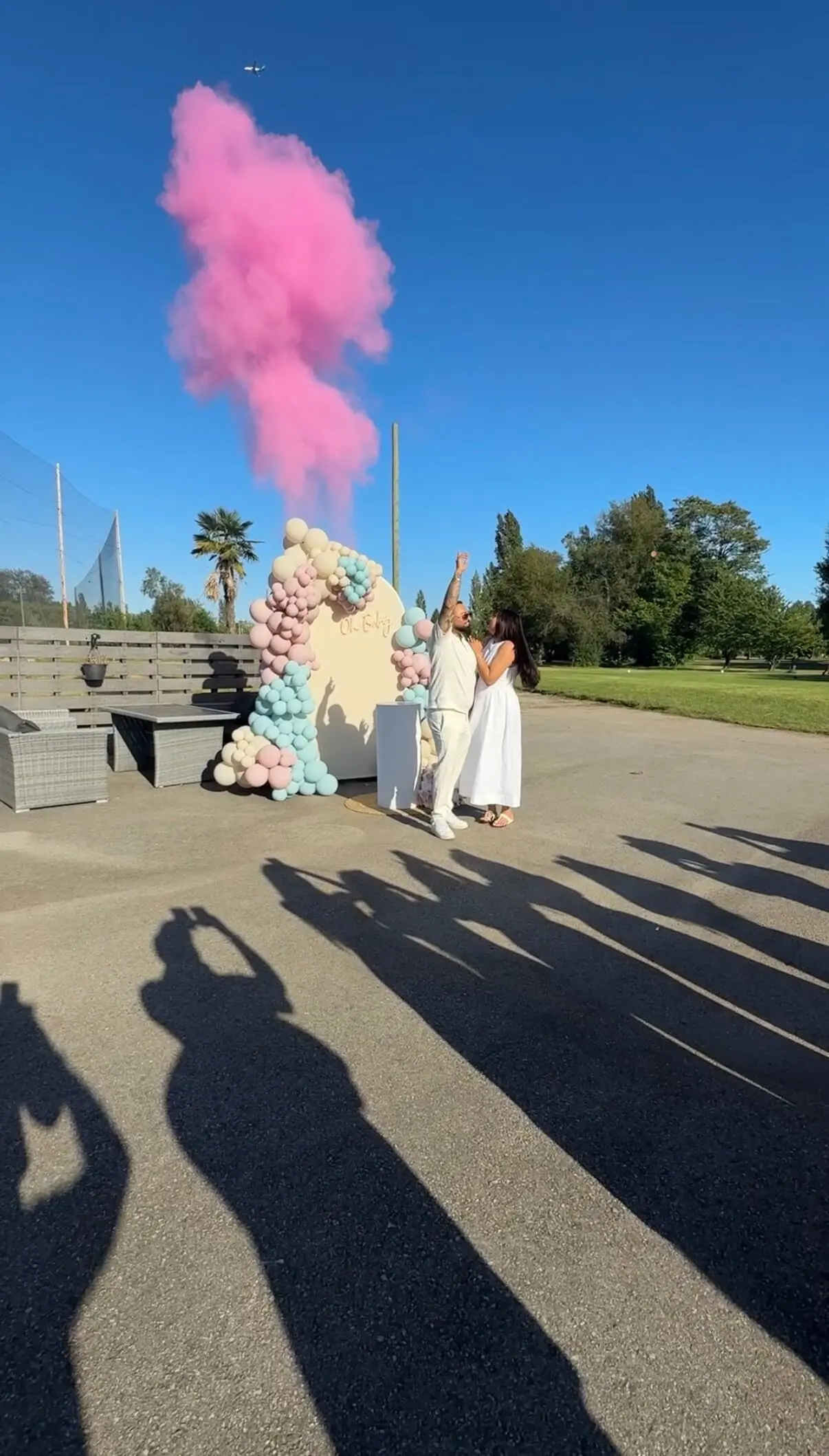 Pink powder cannon effect at a gender reveal